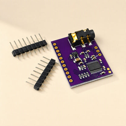 Sounddecode – Purple DAC board with 3.5mm audio jack, chip and two eight-pin black header strips beside it