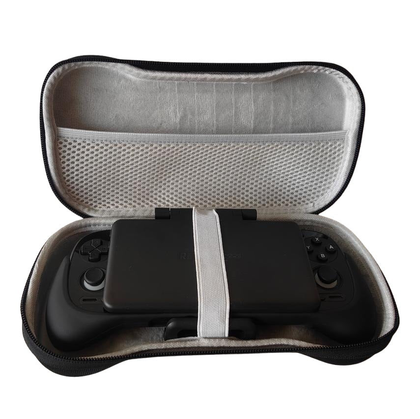 Pockette – Open case with the console secured by a white elastic strap, shown above a grey mesh pocket