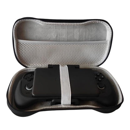 Pockette – Open case with the console secured by a white elastic strap, shown above a grey mesh pocket