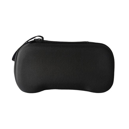 Pockette – Closed black case lying flat, front view showing the curved shape and zipper pull
