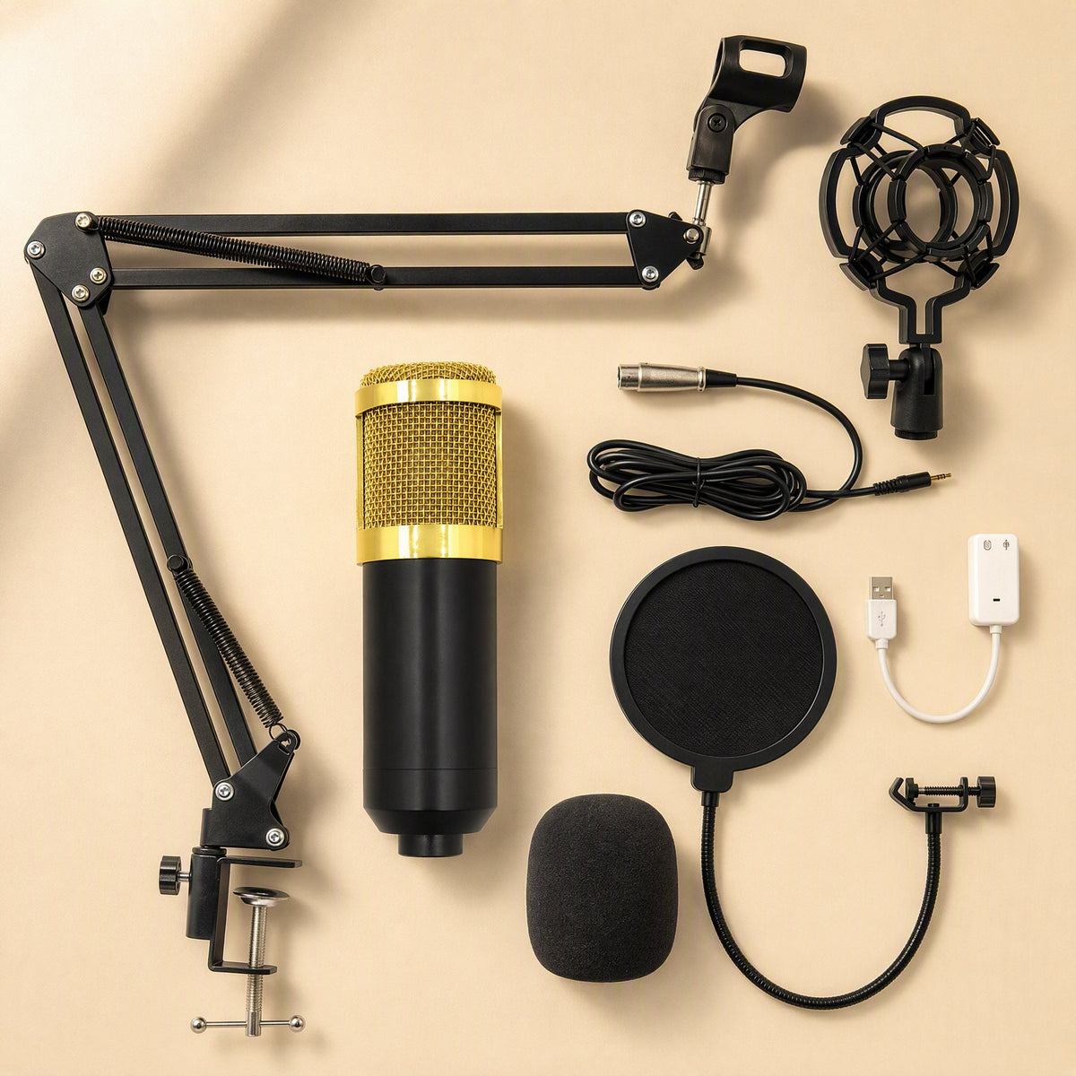 Voxblend – Flat lay of mic, boom arm, pop filter, shock mount, windscreen, XLR cable and USB sound adapter