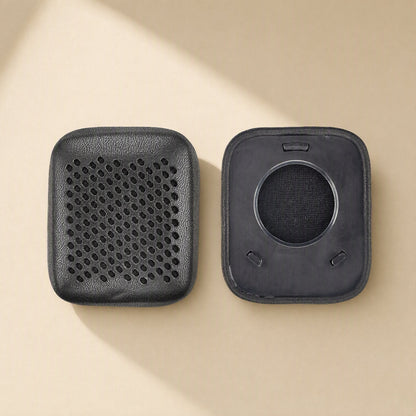 Earsoft – Pair of black perforated ear pad covers, one shown front and one showing the back with clips