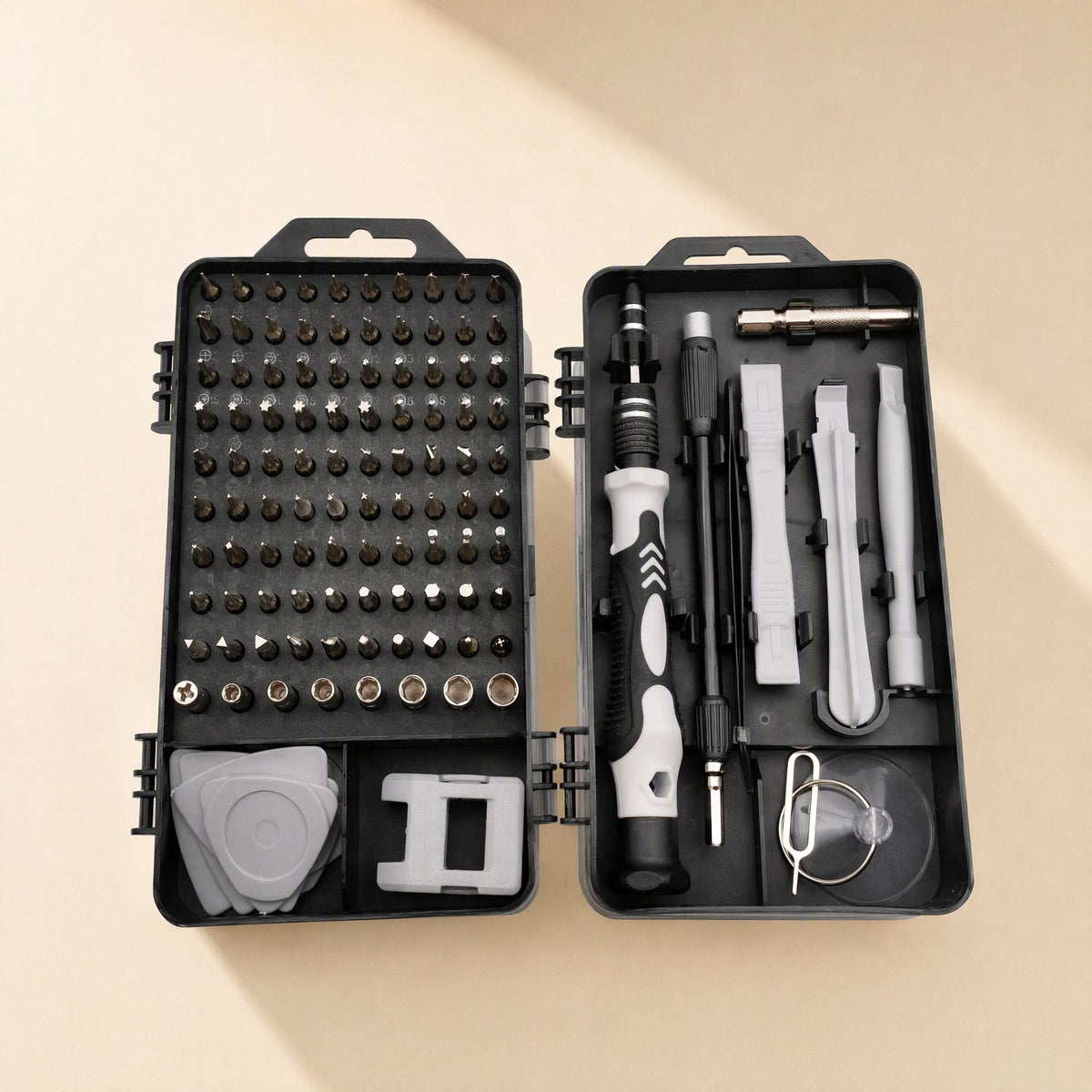 Bitnest 115-in-1 Screwdriver Tool Set open flat, bit grid on left and handle with pry tools on right