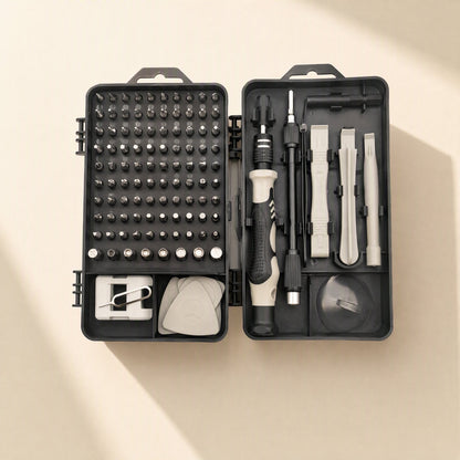 Bitnest – Open black case with grid of screwdriver bits, ratchet handle, spudgers, pick and suction cup, gray accents