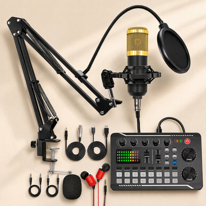 Castvoice – Flat lay of the sound card kit with gold mic, boom arm, mixer with faders, earphones and cables