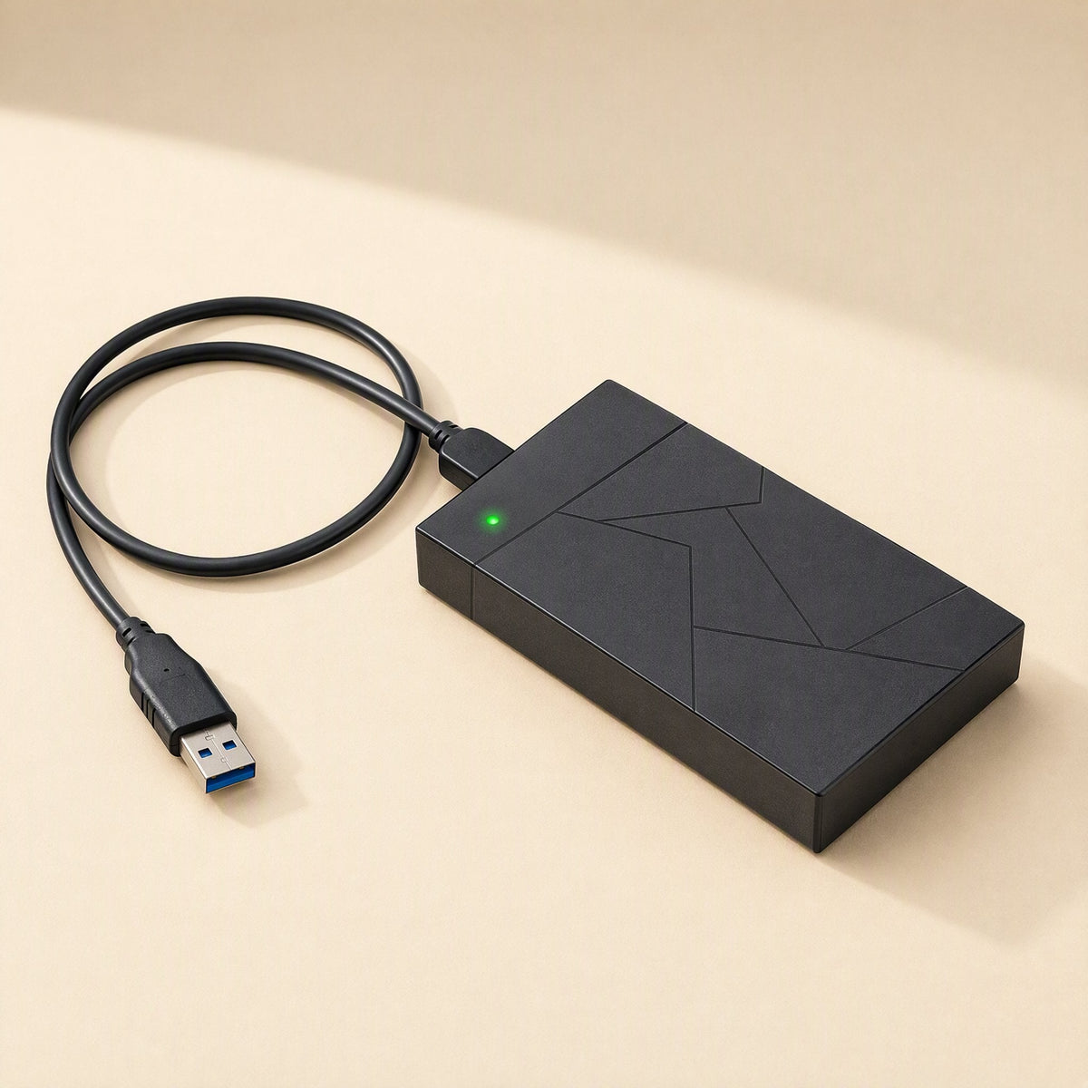 Diskshield – Enclosure with a green indicator light and attached USB 3.0 cable coiled beside it, blue USB connector in view