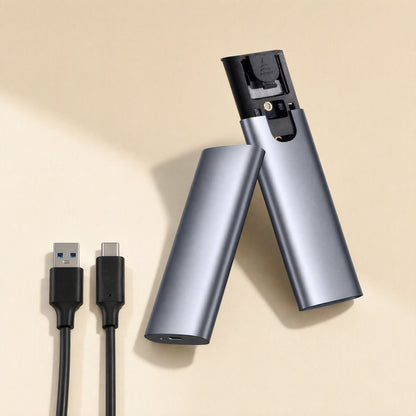Driveguard M.2 Solid State Drive Enclosure opened to show its interior, beside USB-A and USB-C cables