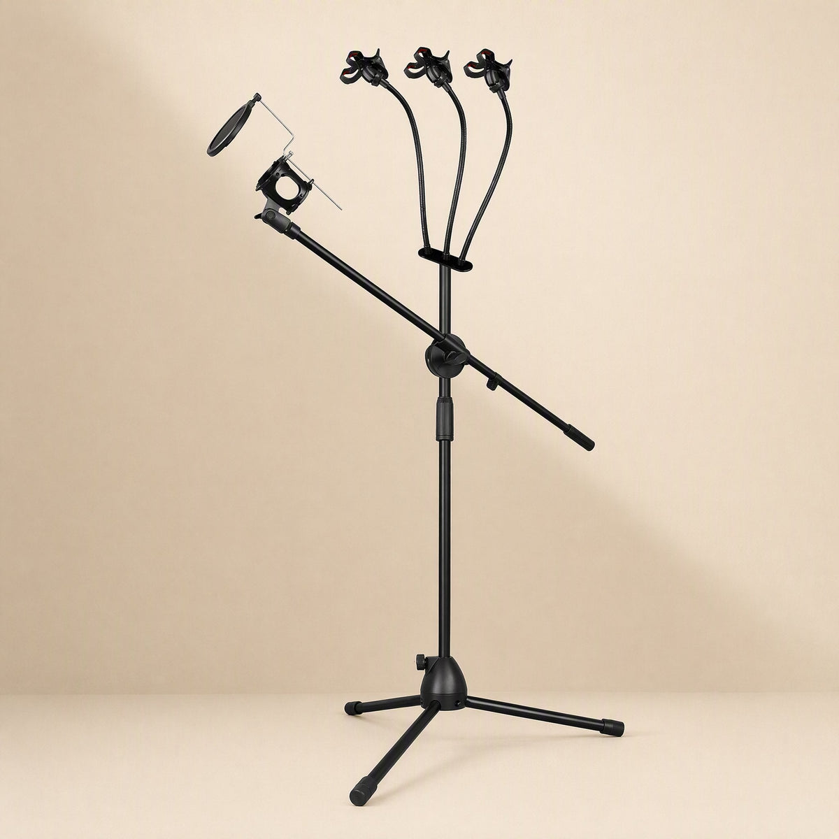 Tripodrise – Black tripod mic stand with boom arm, pop filter and three flexible phone holders on a tan backdrop