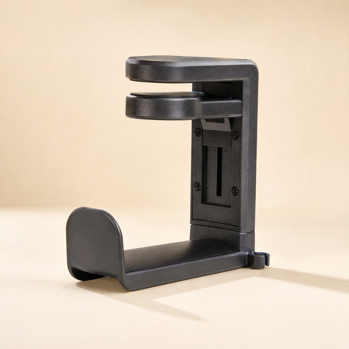 Softperch – Black clamp-style headphone stand showing rotating arm, back plate with screws and lower cradle