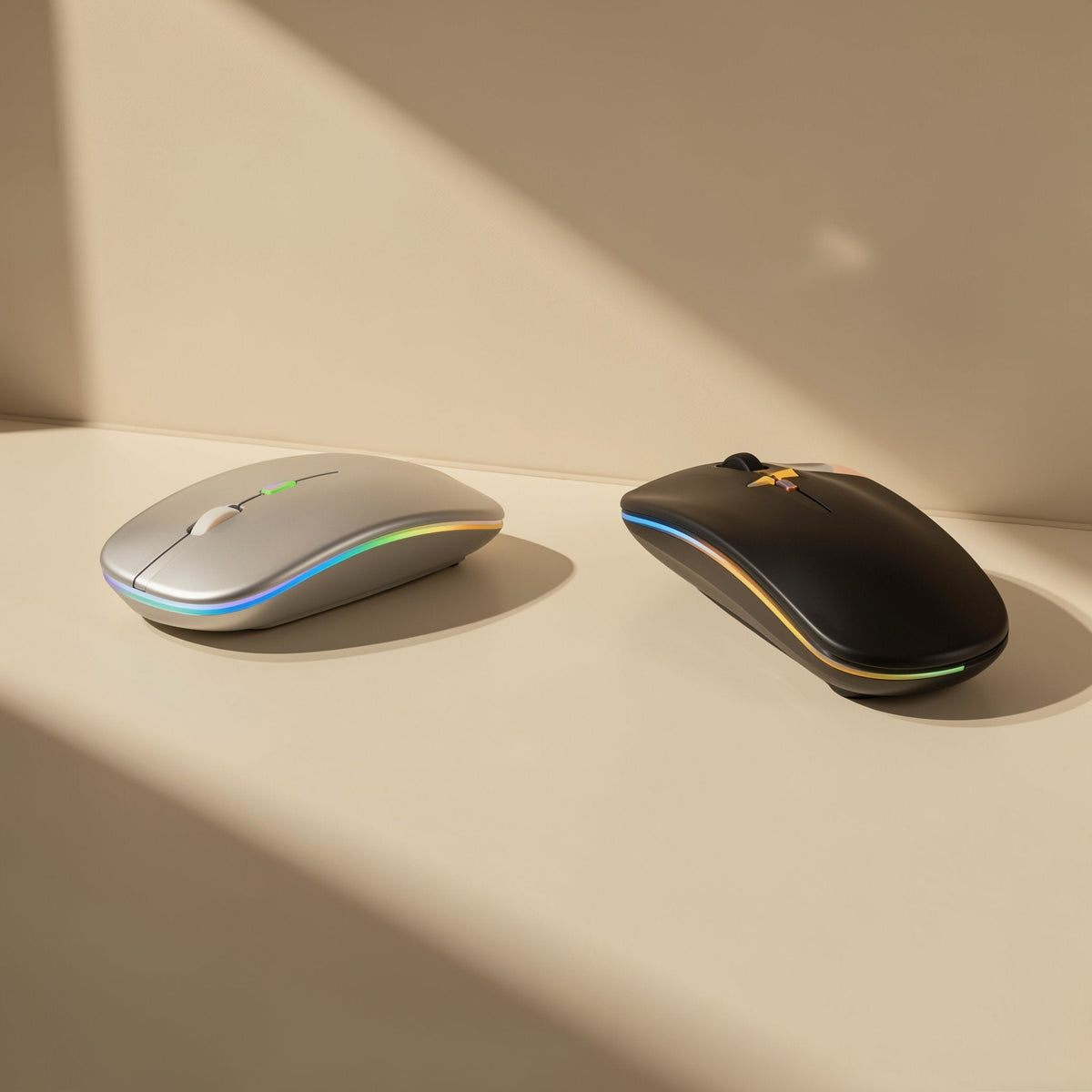 Roamclick – Silver and black wireless mice side by side, each with a colorful LED glow along the edge, in angled sunlight