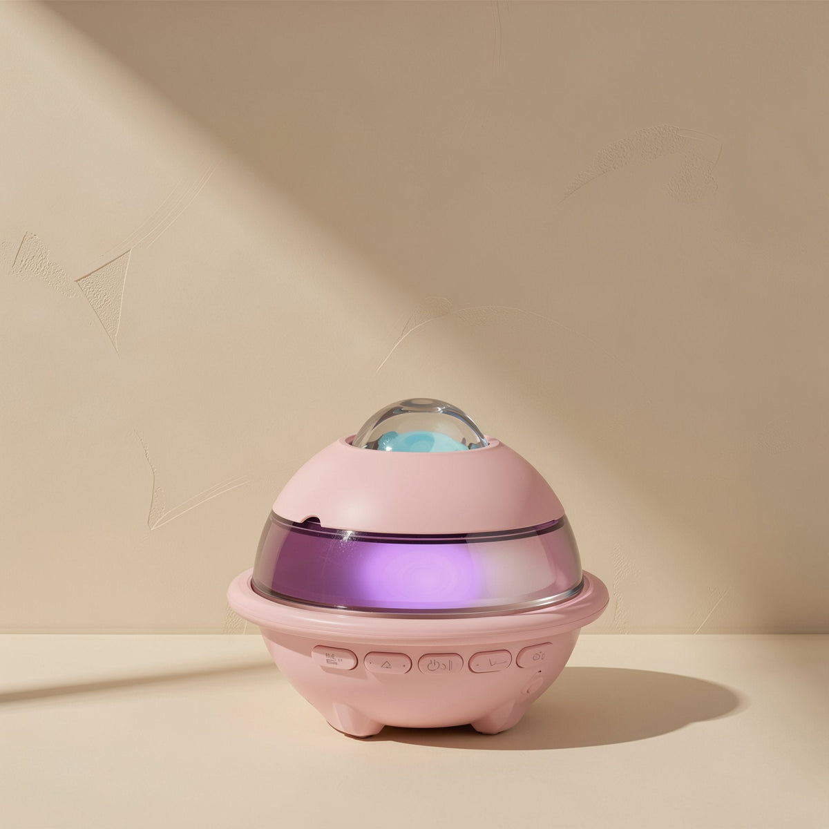 Glowchord Bluetooth Speaker in pink with a glowing purple band and dome light on a cream shelf