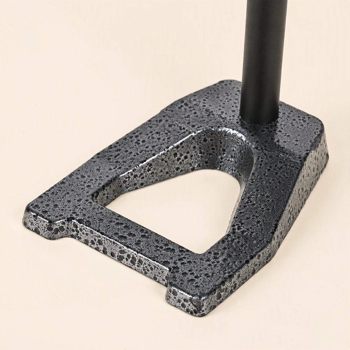 Voicepost Desktop Microphone Stand – close-up of the speckled gray cast metal base with a triangular cutout and black pole