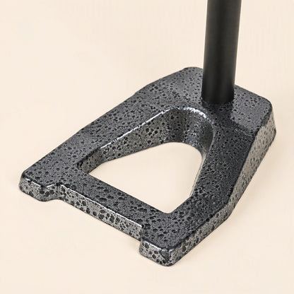 Voicepost Desktop Microphone Stand – close-up of the speckled gray cast metal base with a triangular cutout and black pole