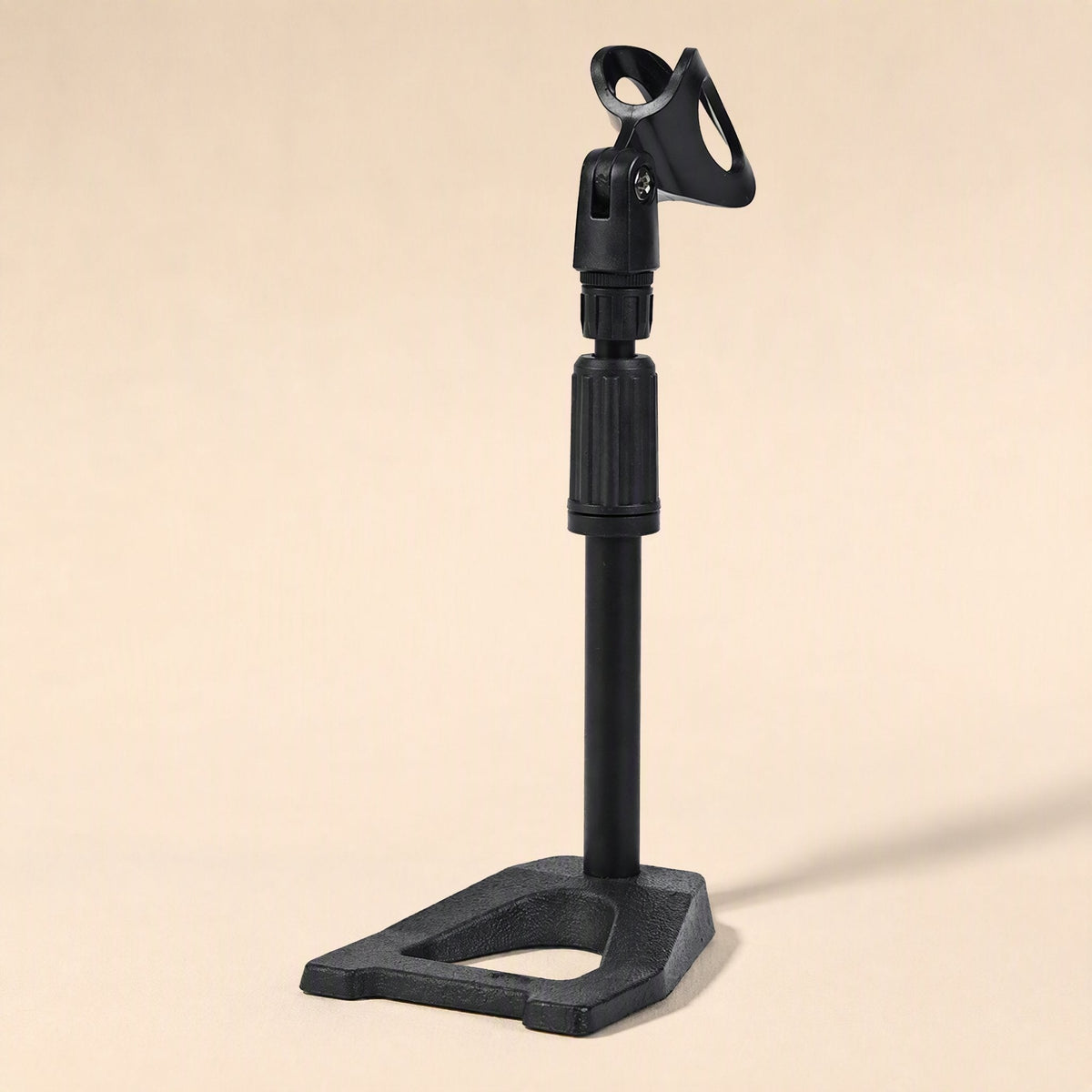 Voicepost Desktop Microphone Stand – black desktop mic stand with cast base and clip, seen from a slightly lower side angle